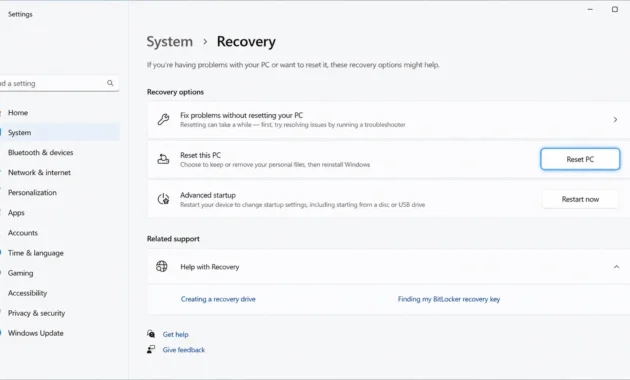 Windows 11 Settings showing the System Recovery page with the Reset PC button highlighted for Dell laptop factory reset
