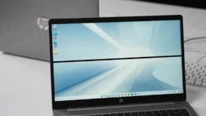 HP laptop screen showing a black horizontal line running across an otherwise normal Windows desktop display